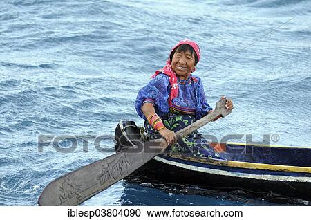 "Kuna Indian woman in a dugout canoe, Wichubuala, San Blas Islands, Caribbean, Panama, North America" View Large Photo Image Stock Image - "Kuna Indian woman in a dugout canoe, Wichubuala, San Blas Islands, Caribbean, Panama, North America". Fotosearch