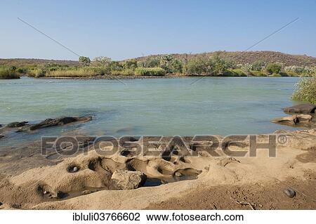 "Kunene River, the boundary river with Angola, Kunene River Lodge, Kunene Region, Namibia, Africa" View Large Photo Image Stock Image - "Kunene River, the boundary river with Angola, Kunene River Lodge, Kunene Region, Namibia, Africa". Fotosearch