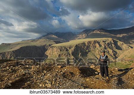 "Kurdish shepherd standing on the edge of a canyon right above Ahmed Awa, Ahmed Awa, Iraqi Kurdistan, Iraq, Asia" View Large Photo Image Stock Photo - "Kurdish shepherd standing on the edge of a canyon right above Ahmed Awa, Ahmed Awa, Iraqi Kurdistan, Iraq, Asia". Fotosearch
