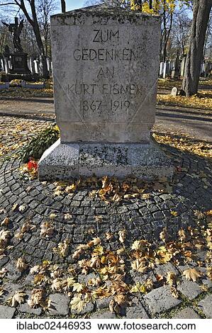 Stock Image - "Kurt Eisner memorial with autumn leaves on the Ostfriedhof or East Cemetery, Munich, Bavaria, Germany, Europe". Fotosearch
