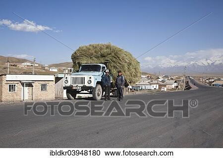 "Kyrgyz men standing next to a fully loaded truck, Sary-Tash, on the border with China, Osh, Kyrgyzstan, Asia" View Large Photo Image Stock Image - "Kyrgyz men standing next to a fully loaded truck, Sary-Tash, on the border with China, Osh, Kyrgyzstan, Asia". Fotosearch