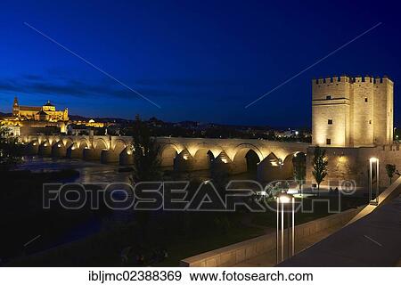 Stock Photo - "La Calahorra Tower, Guadalquivir river, Roman bridge and mosque-cathedral at dusk, Cordoba, Andalusia, Spain, Europe". Fotosearch