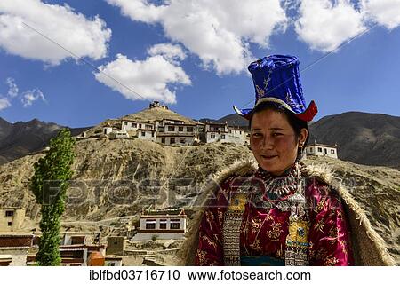 "Ladakhi woman wearing traditional dress, Lamayuru Gompa at back, Lamayuru, Ladakh, Jammu and Kashmir, India, Asia" View Large Photo Image Stock Image - "Ladakhi woman wearing traditional dress, Lamayuru Gompa at back, Lamayuru, Ladakh, Jammu and Kashmir, India, Asia". Fotosearch