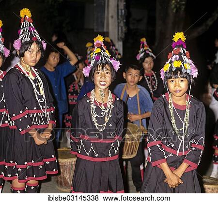 Stock Photo - "Lahu girls in a mountain village with in traditional costume and headdress, dance at a harvest festival, Chiang Rai Province, Northern Thailand, Thailand, Asia". Fotosearch