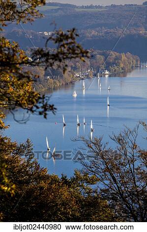"Lake Baldeney with sailboats in Essen-Heisingen, North Rhine-Westphalia, Germany, Europe" View Large Photo Image Stock Image - "Lake Baldeney with sailboats in Essen-Heisingen, North Rhine-Westphalia, Germany, Europe". Fotosearch