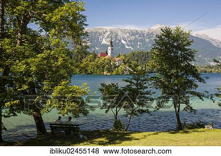 "Lake Bled, looking towards the Pilgrimage Church on Bled Island and the Kamnik Alps, Triglav National Park, Slovenia, Europe" View Large Photo Image Stock Photo - "Lake Bled, looking towards the Pilgrimage Church on Bled Island and the Kamnik Alps, Triglav National Park, Slovenia, Europe". Fotosearch