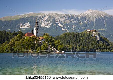 "Lake Bled, overlooking the Pilgrimage Church on Bled Island, Bled Castle and the Kamnik Alps, Triglav National Park, Slovenia, Europe" View Large Photo Image Stock Image - "Lake Bled, overlooking the Pilgrimage Church on Bled Island, Bled Castle and the Kamnik Alps, Triglav National Park, Slovenia, Europe". Fotosearch