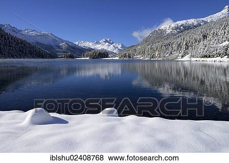 Stock Photo - "Lake Champferersee, snowy Piz da la Margna mountain, St. Moritz, Engadin, canton of Grisons, Switzerland, Europe". Fotosearch
