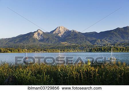 "Lake Faak and Mittagskogel Mountain, Karawanks, Villach, Carinthia, Austria, Europe" View Large Photo Image Stock Photograph - "Lake Faak and Mittagskogel Mountain, Karawanks, Villach, Carinthia, Austria, Europe". Fotosearch