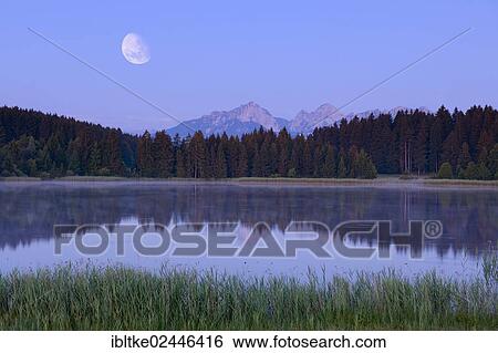 "Lake Hegratsried with the moon, composing, near Fuessen, Allgaeu, Bavaria, Germany, Europe" View Large Photo Image Stock Photograph - "Lake Hegratsried with the moon, composing, near Fuessen, Allgaeu, Bavaria, Germany, Europe". Fotosearch