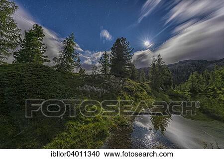 "Lake Limedes by night with moon, Falzarego pass, Dolomites, Veneto, Italy, Europe" View Large Photo Image Stock Image - "Lake Limedes by night with moon, Falzarego pass, Dolomites, Veneto, Italy, Europe". Fotosearch