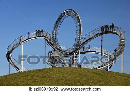 "Landmark Tiger & Turtle - Magic Mountain, walk-in sculpture, Anger Park, Duisburg, North Rhine-Westphalia, Germany, Europe" View Large Photo Image Stock Image - "Landmark Tiger & Turtle - Magic Mountain, walk-in sculpture, Anger Park, Duisburg, North Rhine-Westphalia, Germany, Europe". Fotosearch