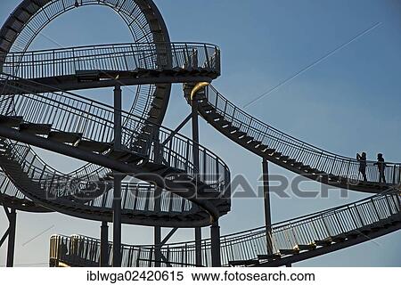 Landmark Tiger & Turtle - Magic Mountain by Heike Mutter and Ulrich Genth, walkable sculpture in the shape of a roller coaster, on the Halde Heinrich-Hildebrand-Hohe heap, Angerpark, Duisburg, North Rhine-Westphalia, Germany, Europe, PublicGround, Europe View Large Photo Image Stock Photography - Landmark Tiger & Turtle - Magic Mountain by Heike Mutter and Ulrich Genth, walkable sculpture in the shape of a roller coaster, on the Halde Heinrich-Hildebrand-Hohe heap, Angerpark, Duisburg, North Rhine-Westphalia, Germany, Europe, PublicGround, Europe. Fotosearch