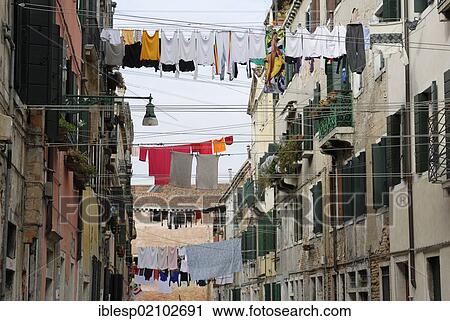 Stock Image - "Landry on clotheslines stretched across an alley, Castello quarter, Venice, Venezia, Veneto, Italy, Europe". Fotosearch