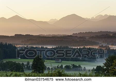 "Landscape in the Alpine Foreland, morning mood with fog, Schonberg, Rottenbuch, Pfaffenwinkel region, Upper Bavaria, Bavaria, Germany, Europe" View Large Photo Image Stock Photography - "Landscape in the Alpine Foreland, morning mood with fog, Schonberg, Rottenbuch, Pfaffenwinkel region, Upper Bavaria, Bavaria, Germany, Europe". Fotosearch