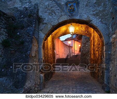 "Lane passing underneath a stone archway at dusk, Hainburg an der Donau, Lower Austria, Austria, Europe" View Large Photo Image Stock Photography - "Lane passing underneath a stone archway at dusk, Hainburg an der Donau, Lower Austria, Austria, Europe". Fotosearch