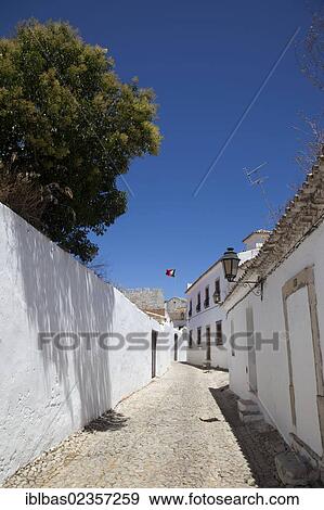 Stock Photo - "Lane with whitewashed houses in Loule, Algarve, Portugal, Europe". Fotosearch