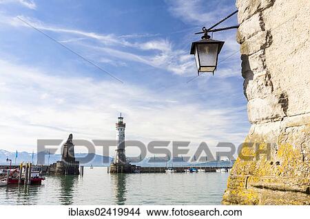 Picture - Lantern on Mangturm tower looking towards the harbour entrance of Lindau on Lake Constance, Lindau, Bavaria, Germany, Europe, PublicGround, Europe. Fotosearch
