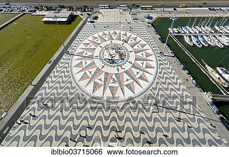 "Large compass in the paving in front of the Monumento a Los Descubrimientos, Monument to the Discoveries, Belem, Lisbon, Lisbon District, Portugal, Europe" View Large Photo Image Stock Photograph - "Large compass in the paving in front of the Monumento a Los Descubrimientos, Monument to the Discoveries, Belem, Lisbon, Lisbon District, Portugal, Europe". Fotosearch