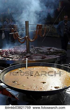 "Large pan containing broth in front of giant barbecue at the annual All Saints Market in Cocentaina, Alicante province, Spain, Europe" View Large Photo Image Stock Photo - "Large pan containing broth in front of giant barbecue at the annual All Saints Market in Cocentaina, Alicante province, Spain, Europe". Fotosearch