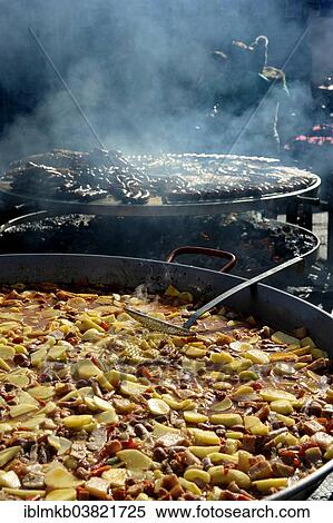 "Large pan containing potato stew in front of giant barbecue at the annual All Saints Market in Cocentaina, Alicante province, Spain, Europe" View Large Photo Image Stock Photography - "Large pan containing potato stew in front of giant barbecue at the annual All Saints Market in Cocentaina, Alicante province, Spain, Europe". Fotosearch