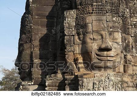 Stock Photography - "Large sculptures of heads on tower of Khmer temple, Bayon, Angkor Thom, Siem Reap, Cambodia, Southeast Asia, Asia". Fotosearch