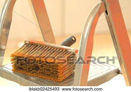 Large used paint brush lying on a ladder View Large Photo Image Stock Image - Large used paint brush lying on a ladder. Fotosearch