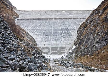 "Largest concrete dam in Switzerland, the Grande Dixence dam at the end of Val d'Herens valley, near Sion, Valais, Switzerland, Europe" View Large Photo Image Stock Photo - "Largest concrete dam in Switzerland, the Grande Dixence dam at the end of Val d'Herens valley, near Sion, Valais, Switzerland, Europe". Fotosearch