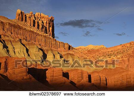 Stock Photo - "Last daylight at The Castle Rock, sunset after a thunderstorm, Capitol Reef National Park, Utah, Southwestern USA, USA". Fotosearch