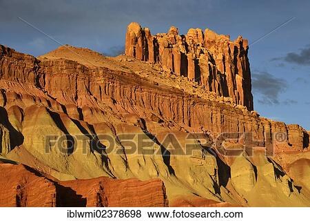 Stock Photo - "Last daylight at The Castle Rock, sunset after a thunderstorm, Capitol Reef National Park, Utah, Southwestern USA, USA". Fotosearch