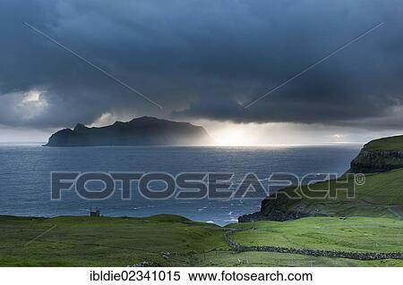 "Last evening sun rays over the island of Mykines in the North Atlantic, Faroe Islands, North Sea, Northern Europe, Europe" View Large Photo Image Stock Photography - "Last evening sun rays over the island of Mykines in the North Atlantic, Faroe Islands, North Sea, Northern Europe, Europe". Fotosearch