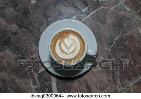 Picture - "Latte art, latte, a rosetta in the milk froth". Fotosearch