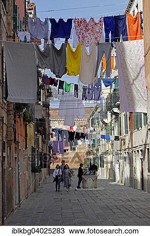 "Laundry drying on laundry lines across the street, Castello, Venice, Veneto, Italy, Europe" View Large Photo Image Stock Image - "Laundry drying on laundry lines across the street, Castello, Venice, Veneto, Italy, Europe". Fotosearch