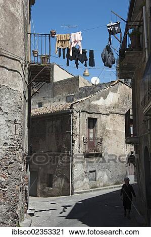 Stock Image - "Laundry hanging to dry between houses, Randazzo, Sicily, Italy, Europe". Fotosearch