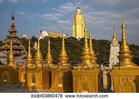 "Lay Kyun Sakkya, standing Buddha, reclining Buddha, statues, and Aung Sakkya Pagoda, Maha Bodhi Ta Htaung monastery, Monywa, Sagaing Division, Myanmar, Asia" View Large Photo Image Stock Photo - "Lay Kyun Sakkya, standing Buddha, reclining Buddha, statues, and Aung Sakkya Pagoda, Maha Bodhi Ta Htaung monastery, Monywa, Sagaing Division, Myanmar, Asia". Fotosearch