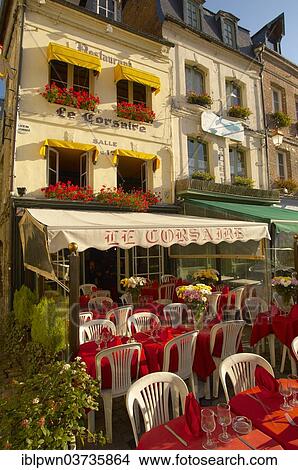 Picture - "Le Corsaire restaurant with terrace tables set ready for lunch, Honfleur, Normandy, France, Europe". Fotosearch