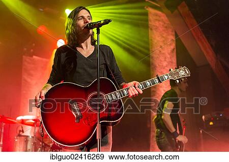 Lead singer and frontman Adrian Sieber from the Swiss pop band Lovebugs performing live in the Schueuer concert hall, Lucerne, Switzerland, Europe View Large Photo Image Stock Photo - Lead singer and frontman Adrian Sieber from the Swiss pop band Lovebugs performing live in the Schueuer concert hall, Lucerne, Switzerland, Europe. Fotosearch