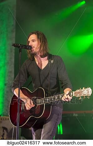 Lead singer and frontman Adrian Sieber from the Swiss pop band Lovebugs performing live in the Schueuer concert hall, Lucerne, Switzerland, Europe View Large Photo Image Stock Photo - Lead singer and frontman Adrian Sieber from the Swiss pop band Lovebugs performing live in the Schueuer concert hall, Lucerne, Switzerland, Europe. Fotosearch