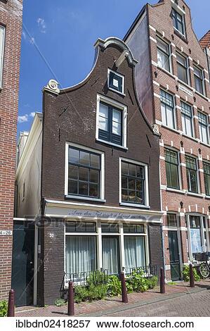 Stock Photo - Leaning house in Amsterdam, Holland, Netherlands, Europe. Fotosearch