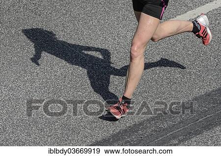 "Legs and shadow of a marathon runner, Hamburg, Germany, Europe" View Large Photo Image Stock Photo - "Legs and shadow of a marathon runner, Hamburg, Germany, Europe". Fotosearch