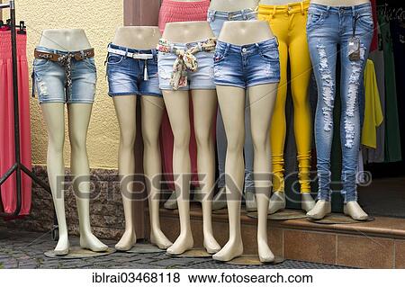 Stock Photo - "Legs of mannequins with jeans and hot pants, in front of a fashion shop, Budingen, Hesse, Germany, Europe". Fotosearch