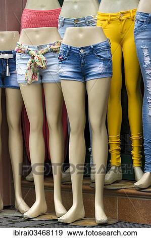 Stock Photo - "Legs of mannequins with jeans and hot pants, in front of a fashion shop, Budingen, Hesse, Germany, Europe". Fotosearch