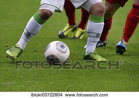 "Legs of players from Borussia Moenchengladbach and Bayer Leverkusen with a ball, Leverkusen, North Rhine-Westphalia, Germany, Europe" View Large Photo Image Picture - "Legs of players from Borussia Moenchengladbach and Bayer Leverkusen with a ball, Leverkusen, North Rhine-Westphalia, Germany, Europe". Fotosearch