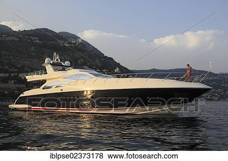 "Leonardo II, a cruiser built by Azimut, type of boat: Leonardo 98, length: 30. 15 m, built in 2004, a young woman sitting on the bow, French Riviera, France, Mediterranean Sea, Europe" View Large Photo Image Stock Photo - "Leonardo II, a cruiser built by Azimut, type of boat: Leonardo 98, length: 30. 15 m, built in 2004, a young woman sitting on the bow, French Riviera, France, Mediterranean Sea, Europe". Fotosearch