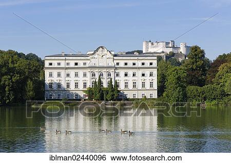 "Leopoldskron Palace, Leopoldskroner Teich pond, Hohensalzburg Castle at the back, Salzburg, Austria, Europe, PublicGround, Europe" View Large Photo Image Stock Photograph - "Leopoldskron Palace, Leopoldskroner Teich pond, Hohensalzburg Castle at the back, Salzburg, Austria, Europe, PublicGround, Europe". Fotosearch