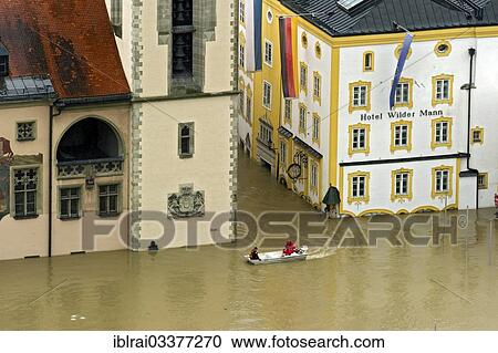 "Lifeboat from the Wasserwacht lifeguards in front of the Town Hall with the flood waters covering the historical flood level indicator, Hotel Wilder Mann during the floods on 3rd June 2013, Passau, Lower Bavaria, Bavaria, Germany, Europe" View Large Photo Image Stock Image - "Lifeboat from the Wasserwacht lifeguards in front of the Town Hall with the flood waters covering the historical flood level indicator, Hotel Wilder Mann during the floods on 3rd June 2013, Passau, Lower Bavaria, Bavaria, Germany, Europe". Fotosearch