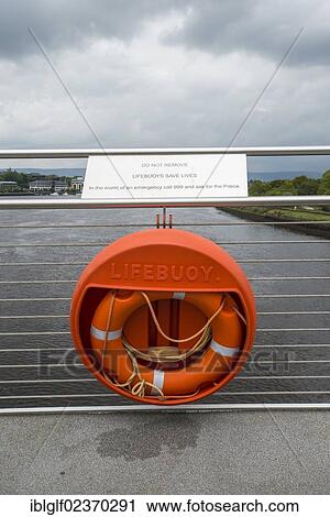 Stock Image - "Lifebuoy on Peace Bridge, Craigavon Bridge over the River Foyle, County Londonderry, Northern Ireland, United Kingdom, Europe". Fotosearch