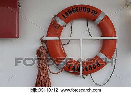Stock Image - "Lifebuoy on the ferry between Bensersiel and Langeoog, Langeoog, Ostfriesische Inseln, Lower Saxony, Germany, Europe". Fotosearch