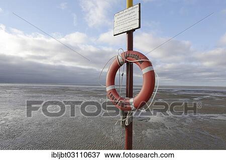 "Lifebuoy on the main beach, Langeoog, Ostfriesische Inseln, Lower Saxony, Germany, Europe" View Large Photo Image Stock Photo - "Lifebuoy on the main beach, Langeoog, Ostfriesische Inseln, Lower Saxony, Germany, Europe". Fotosearch