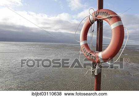 "Lifebuoy on the main beach, Langeoog, Ostfriesische Inseln, Lower Saxony, Germany, Europe" View Large Photo Image Stock Photo - "Lifebuoy on the main beach, Langeoog, Ostfriesische Inseln, Lower Saxony, Germany, Europe". Fotosearch
